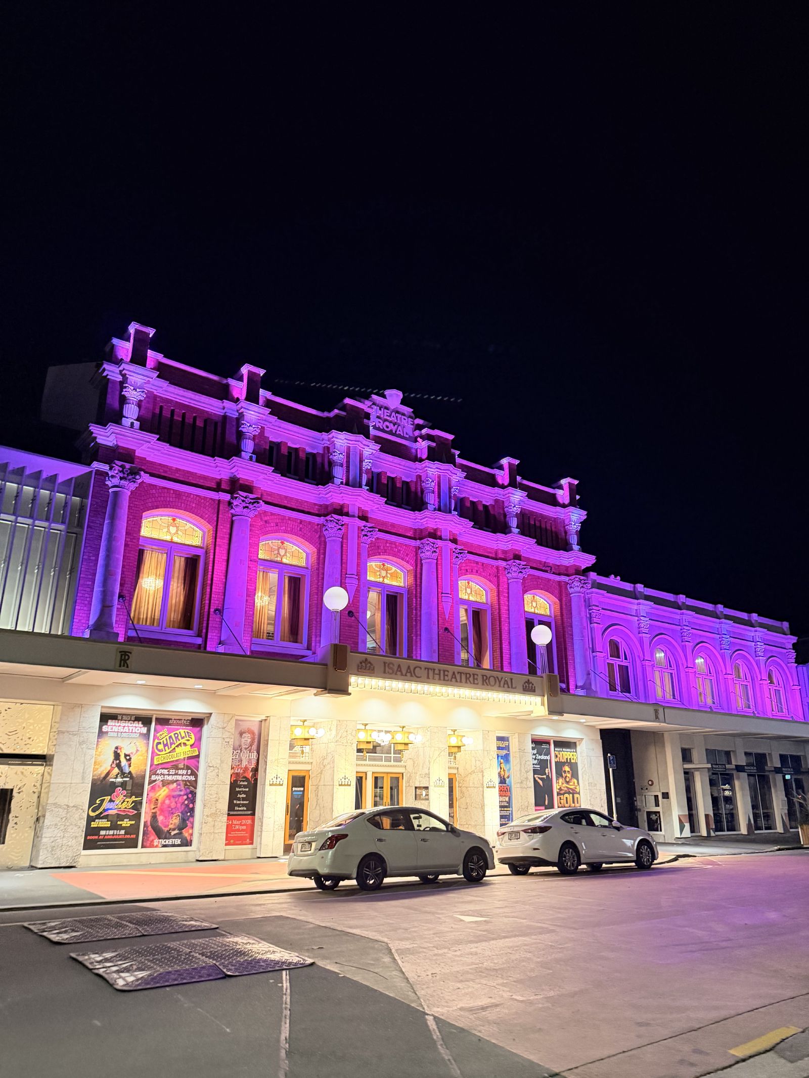 Isaac Theatre Royal lit up in purple at night